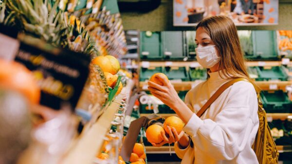 A woman shopping in a grocery store.